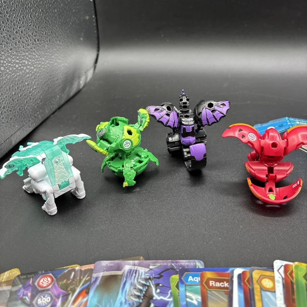 Lot Of 9 Bakugan Figures And 23 Bakugan Cards/Metal Card